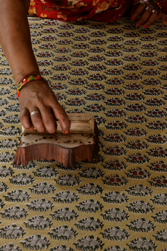 Jaipur artisan hand block printing botanical cotton fabric — traditional craft process behind Daughters of India